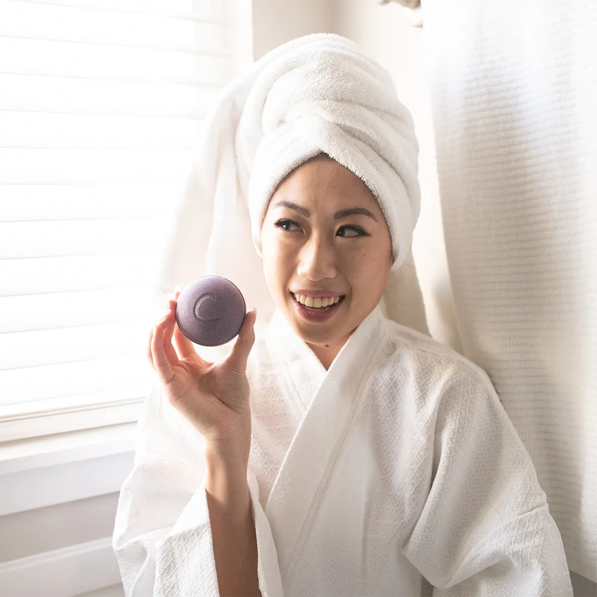 Cosset Bedtime Therapy Bath Bomb dissolving in water